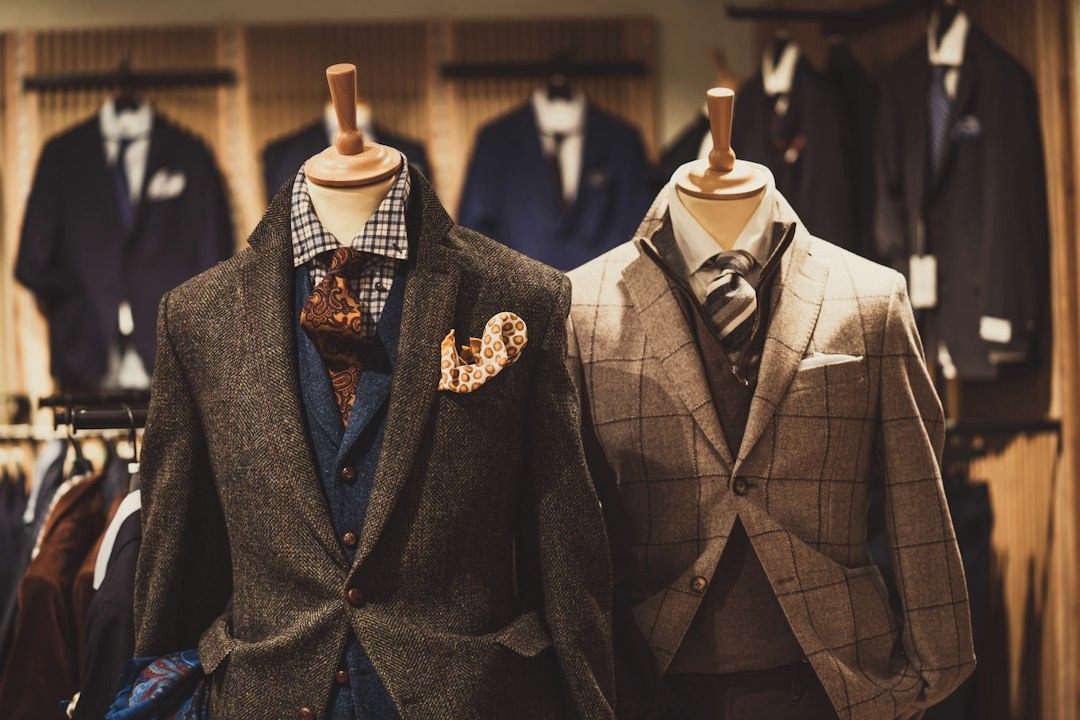 Two mannequins dressed in stylish men's business casual outfits.